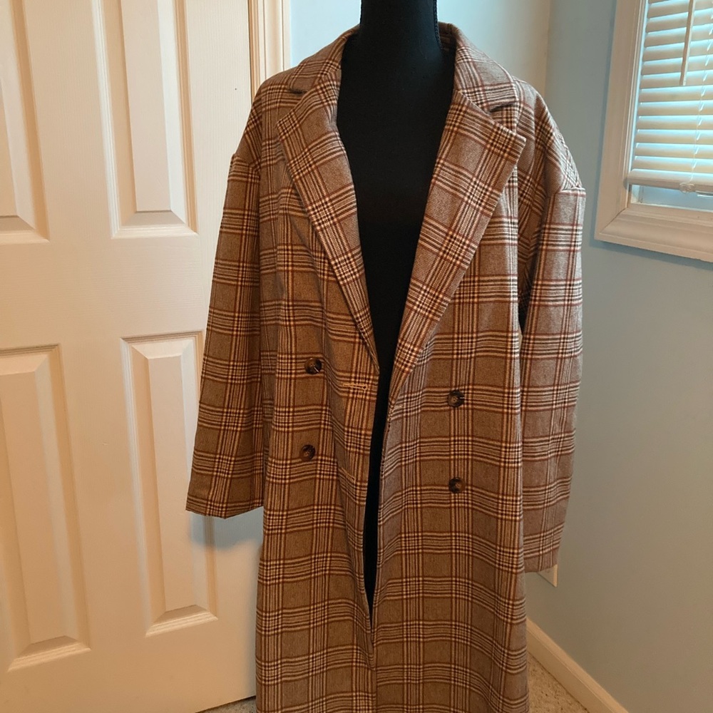 Double breasted plaid coat.